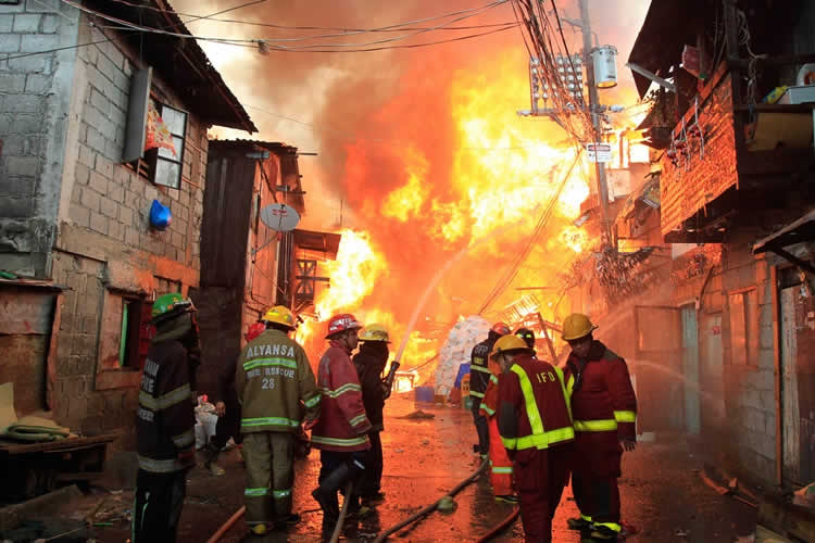 Narrow streets and side-by-side houses make many Philippine cities a tinderbox ready to burst into flames